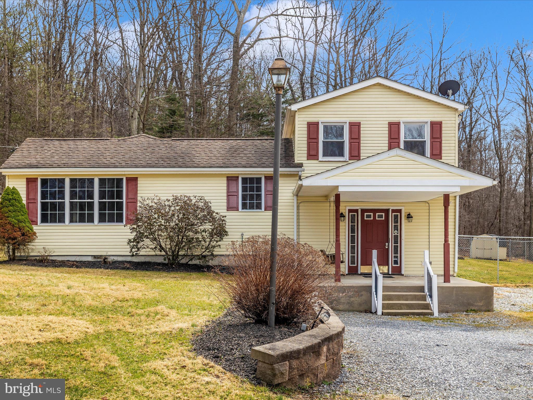 4439 John Draper Road Smithsburg, MD 21783 - Photo 5 of 63 a front view of a house with a yard outdoor seating and barbeque oven