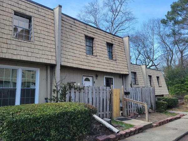 a front view of a house with garage