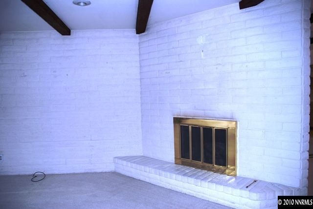 4803 Lakeridge Terrace West Reno, NV 89509 - Photo 3 of 6 a view of an empty room with a fireplace