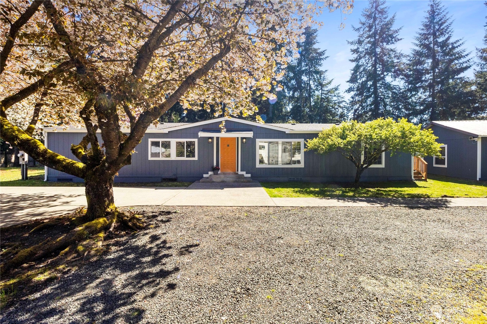 18441 Elaine Court Southwest Rochester, WA 98579 - Photo 2 of 30 a house view with a garden space