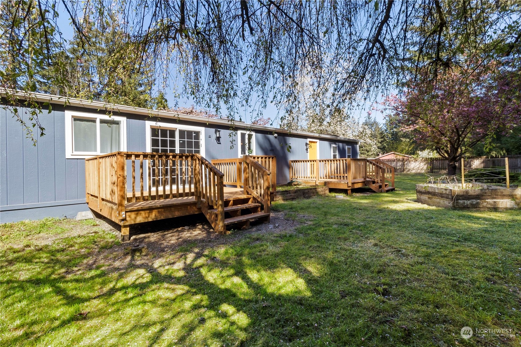 18441 Elaine Court Southwest Rochester, WA 98579 - Photo 25 of 30 a view of a house with backyard and sitting area