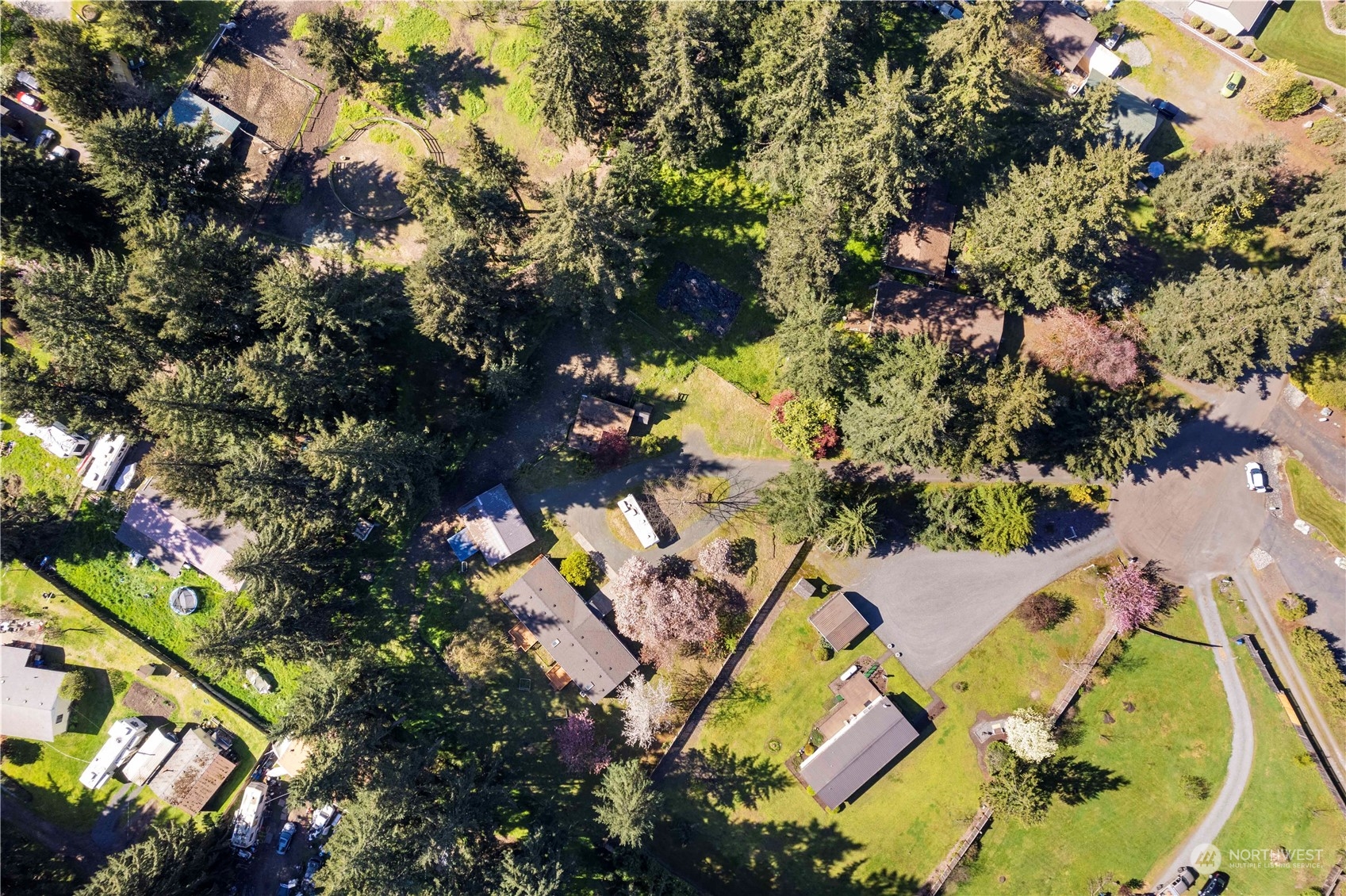 18441 Elaine Court Southwest Rochester, WA 98579 - Photo 27 of 30 an aerial view of a house with a yard and swimming pool