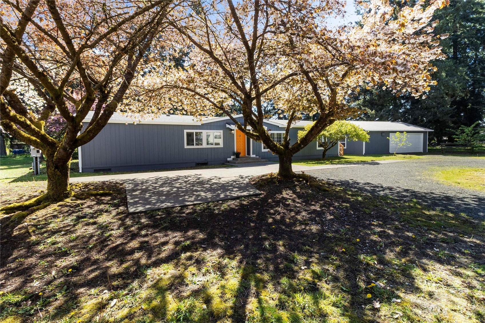 18441 Elaine Court Southwest Rochester, WA 98579 - Photo 3 of 30 a front view of a house with a yard and trees