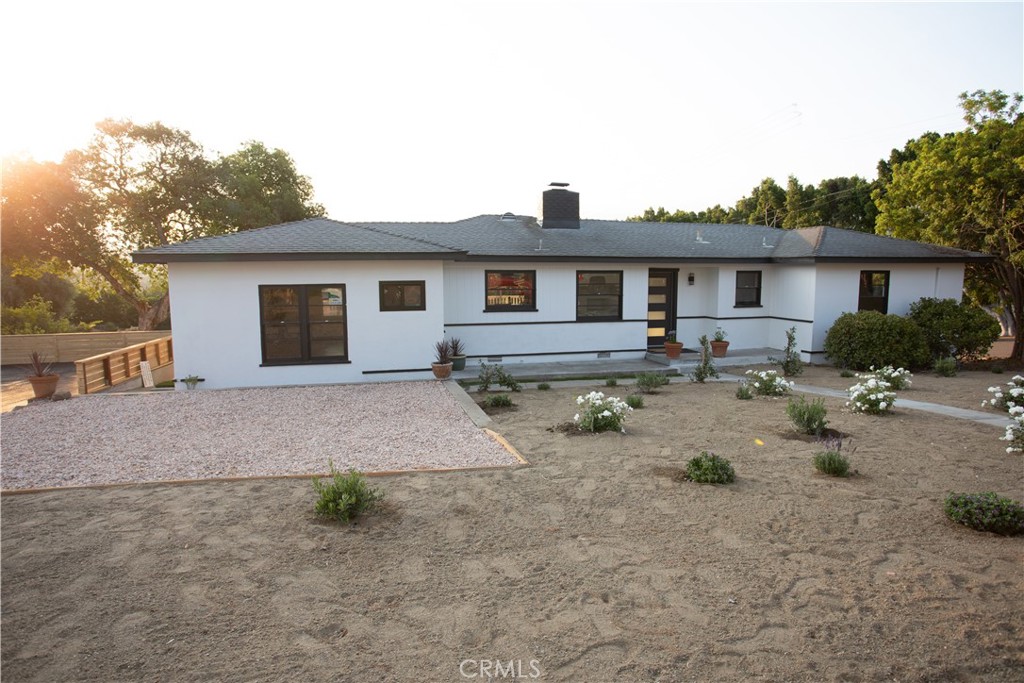 a view of a yard and a house