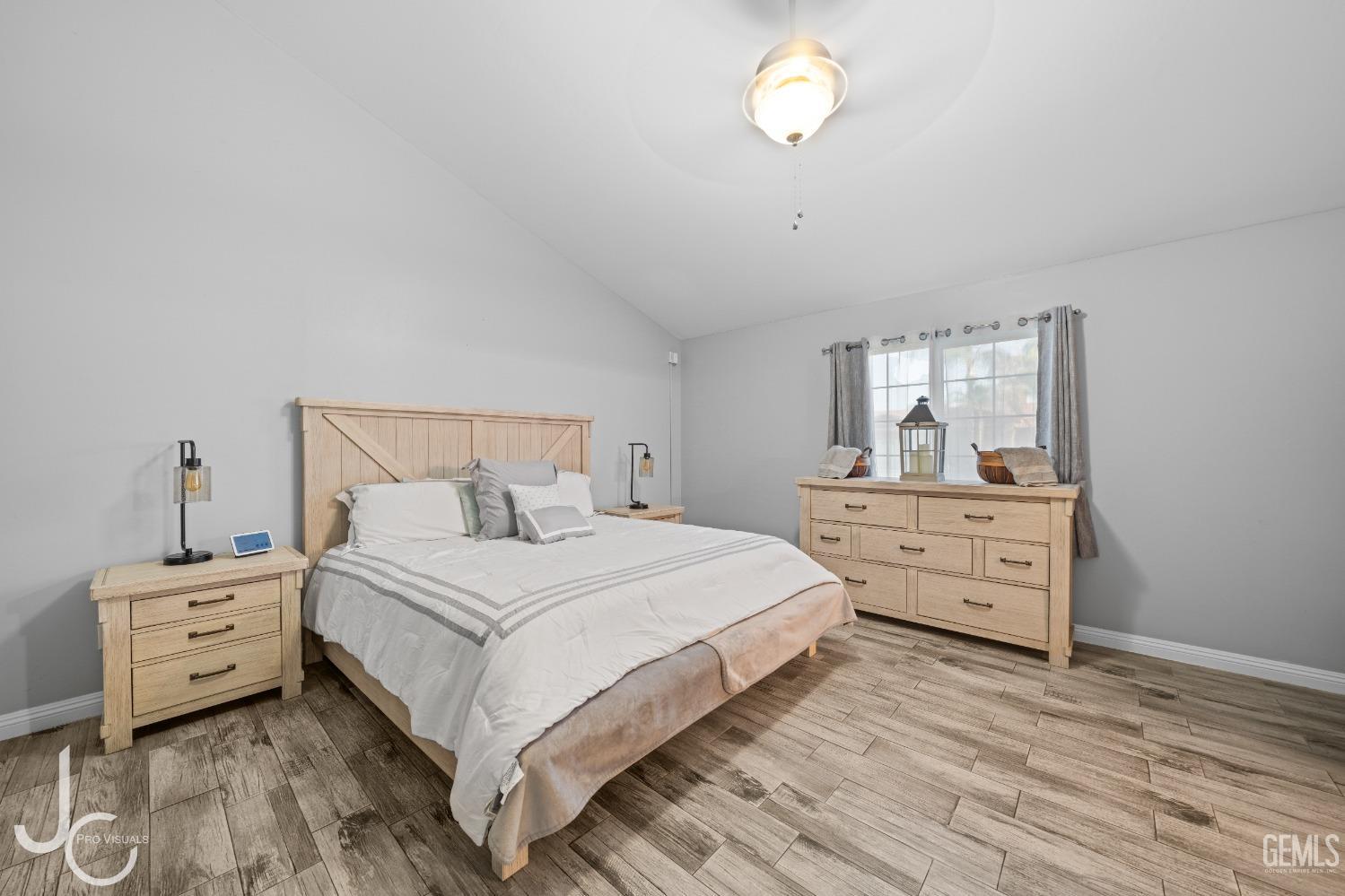 Undisclosed Address Bakersfield, CA 93307 - Photo 20 of 31 a bedroom with a bed and a dresser