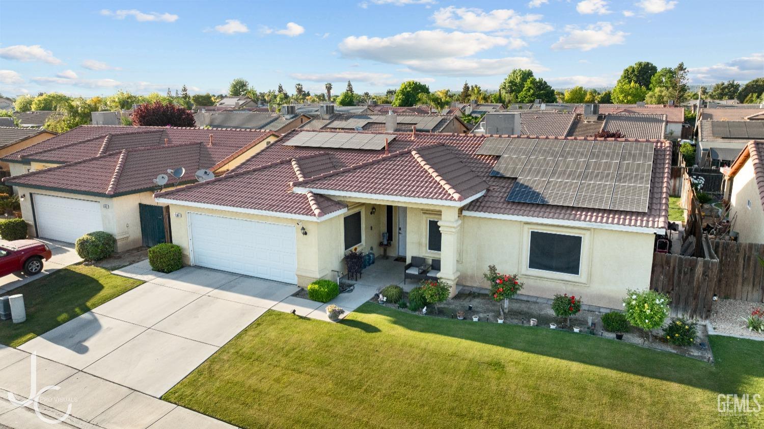 Undisclosed Address Bakersfield, CA 93307 - Photo 2 of 31 a front view of a house with garden