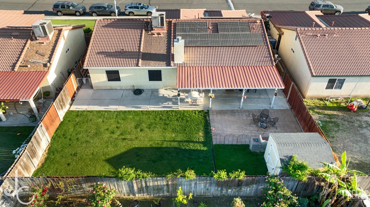 Undisclosed Address Bakersfield, CA 93307 - Photo 29 of 31 an aerial view of a house with garden space and street view