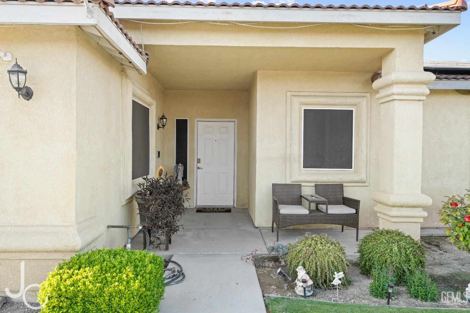 Undisclosed Address Bakersfield, CA 93307 - Photo 3 of 31 a living room with furniture and a potted plant