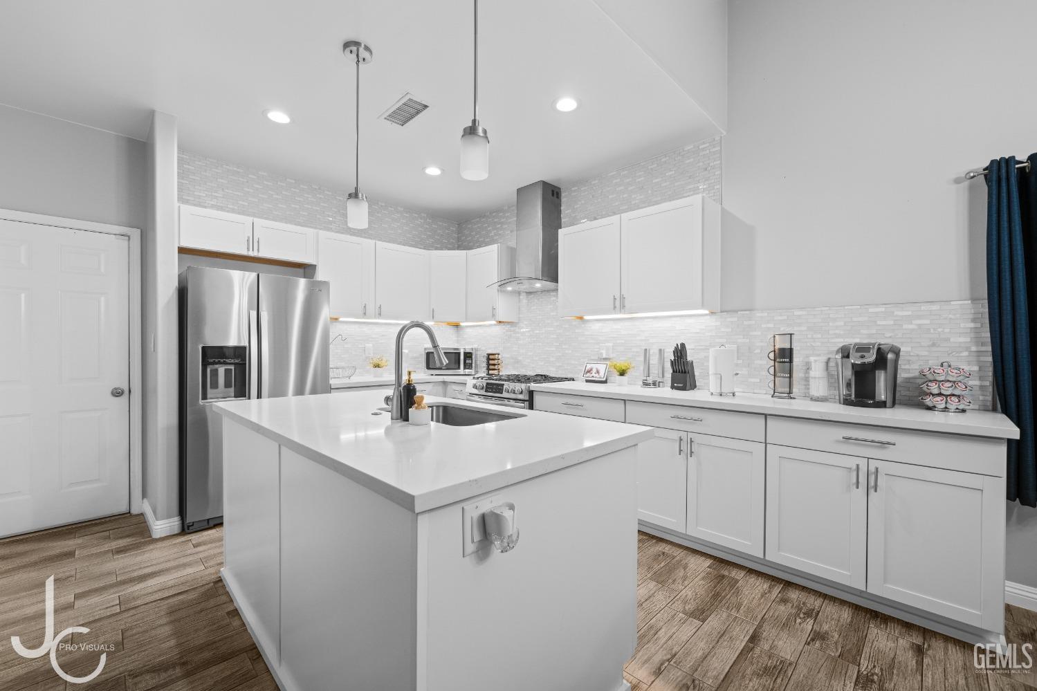 Undisclosed Address Bakersfield, CA 93307 - Photo 10 of 31 a kitchen with a sink window and cabinets