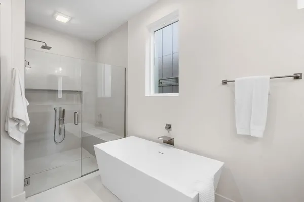 a view of an empty room with a bathroom