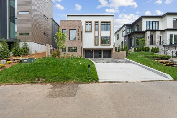 a large kitchen with stainless steel appliances granite countertop a stove a sink and a granite counter tops