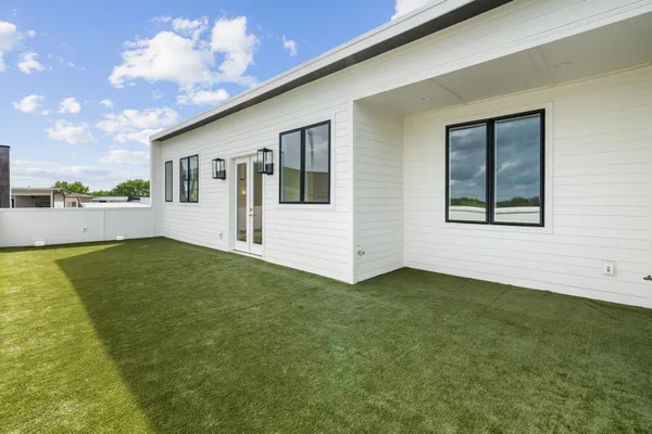 a view of a back yard of the house