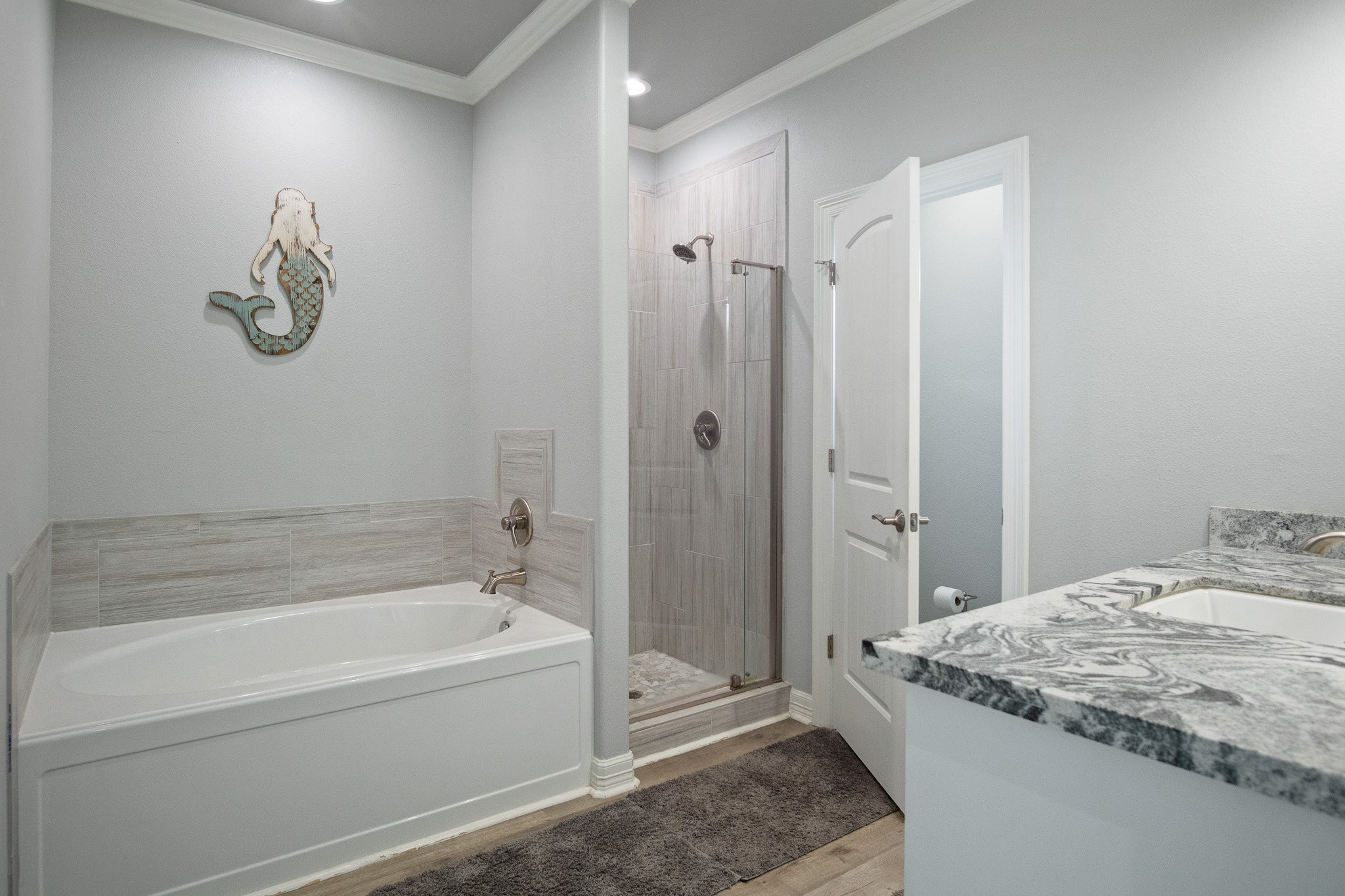 1819 Redfish Lane Crystal Beach, TX 77650 - Photo 14 of 34 a bathroom with a granite countertop sink a toilet and shower