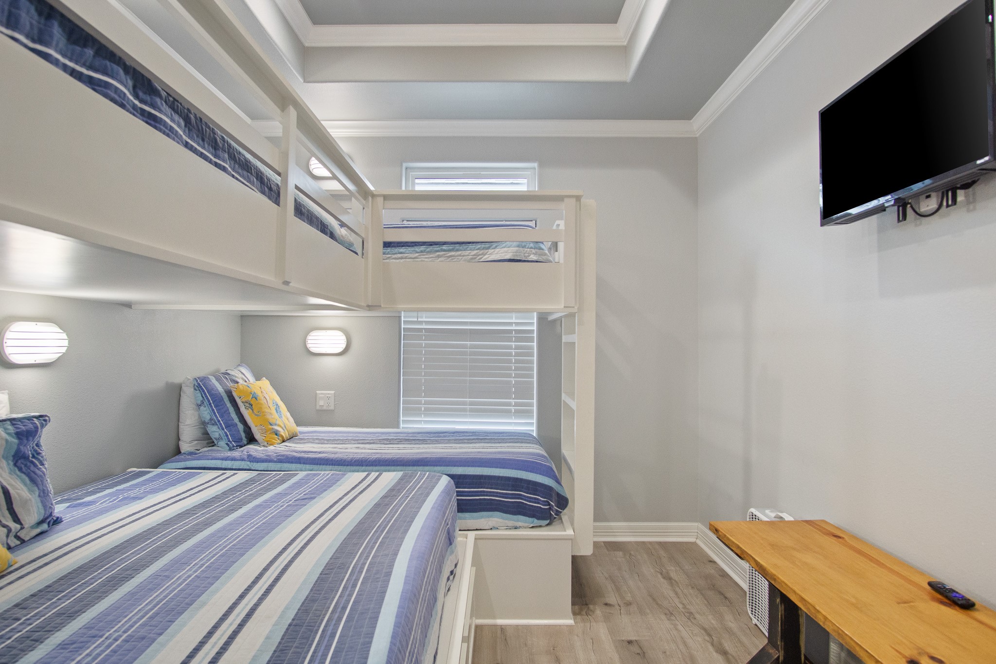 1819 Redfish Lane Crystal Beach, TX 77650 - Photo 19 of 34 a bedroom with a bed and a flat screen tv