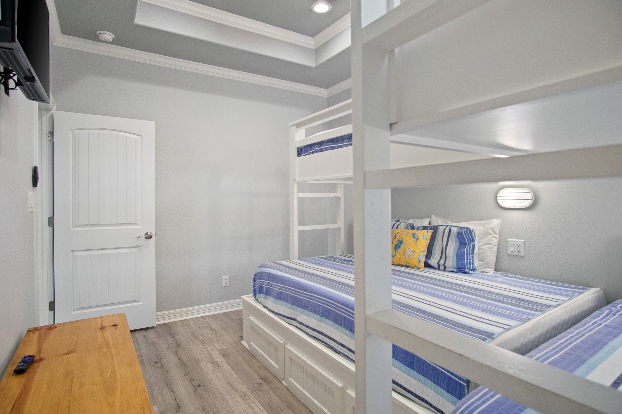 1819 Redfish Lane Crystal Beach, TX 77650 - Photo 31 of 34 a bedroom with a bed and wooden floor