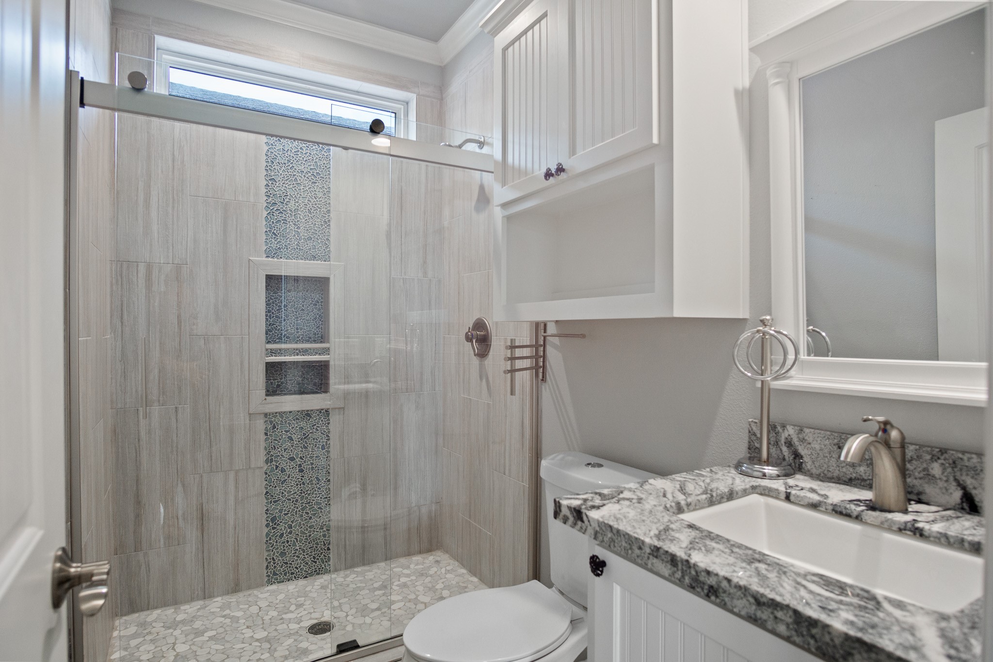 1819 Redfish Lane Crystal Beach, TX 77650 - Photo 32 of 34 a bathroom with a granite countertop sink toilet and shower