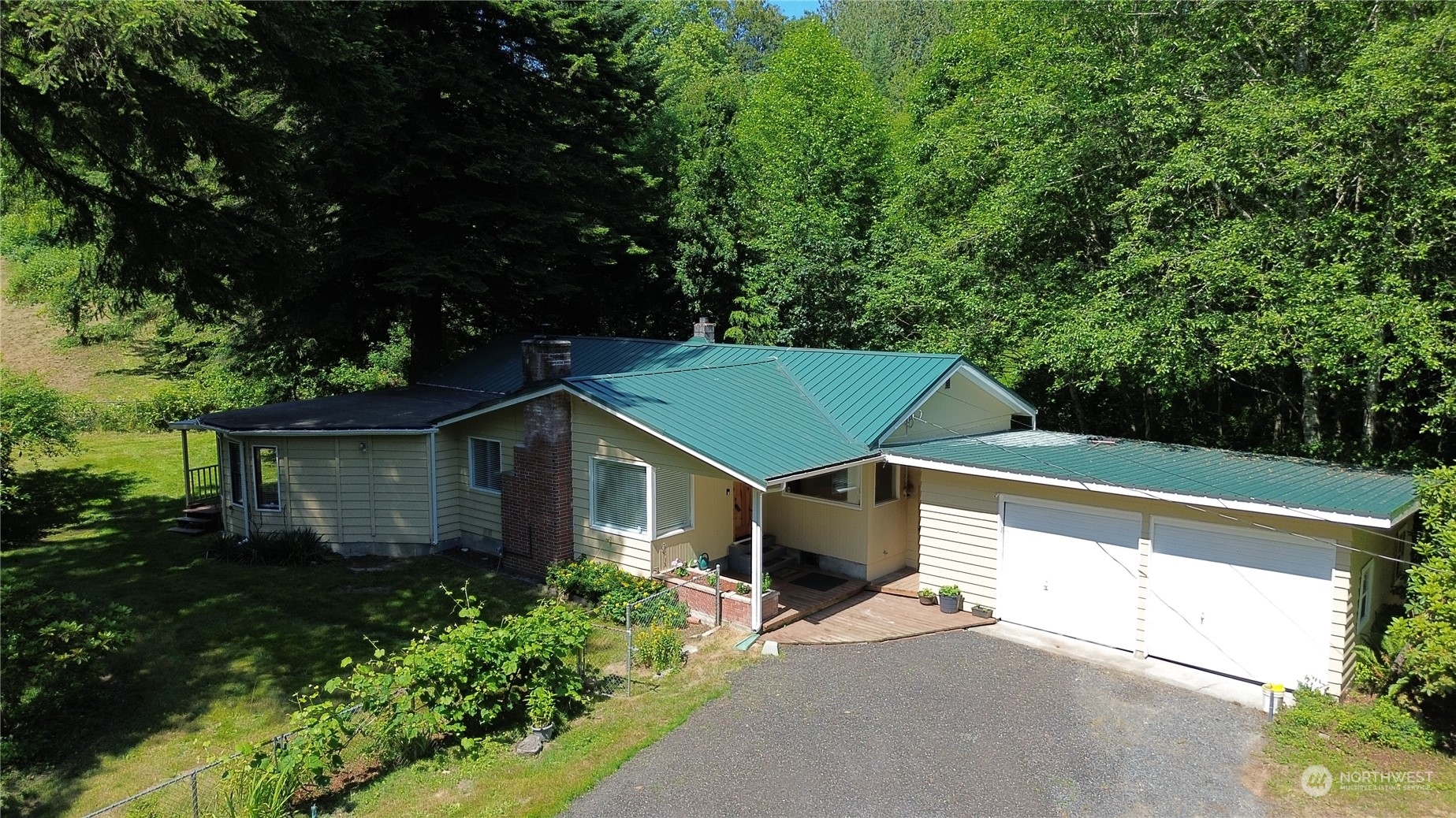 16105 OK Mill Road Snohomish, WA 98290 - Photo 1 of 34 a front view of a house with a yard