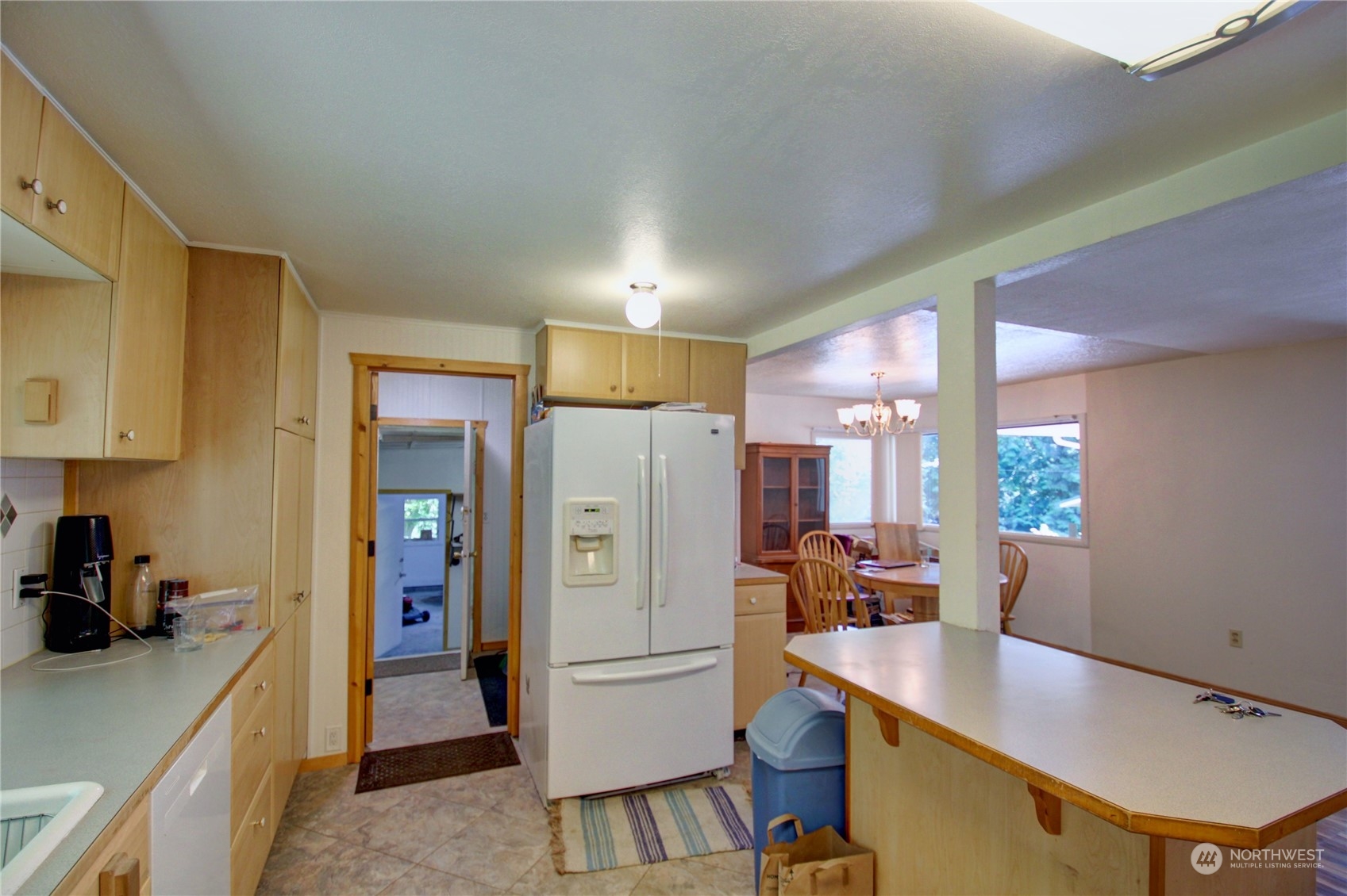 16105 OK Mill Road Snohomish, WA 98290 - Photo 11 of 34 a kitchen with a refrigerator a stove and a sink