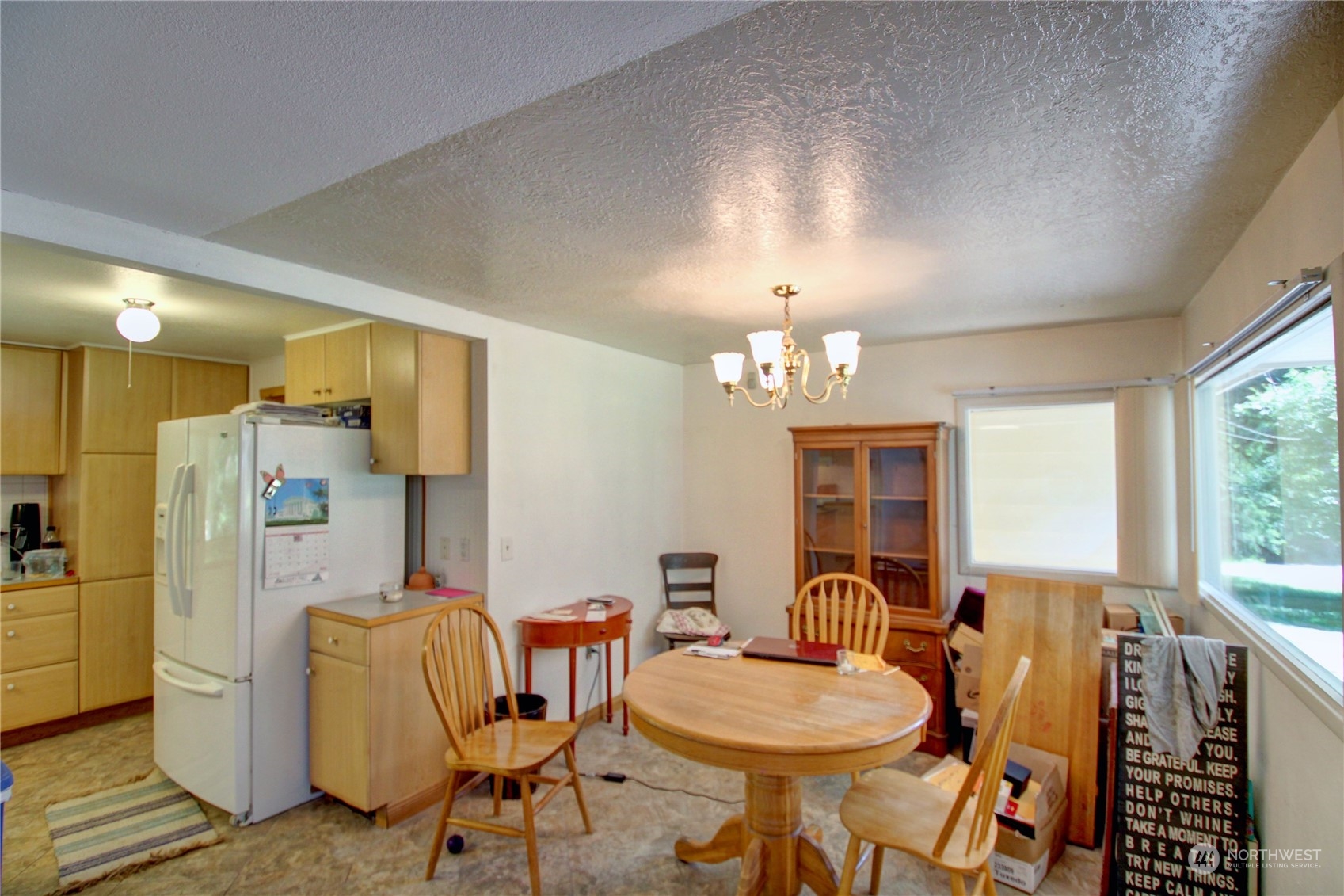 16105 OK Mill Road Snohomish, WA 98290 - Photo 12 of 34 a view of a dining room with furniture a chandelier and wooden floor