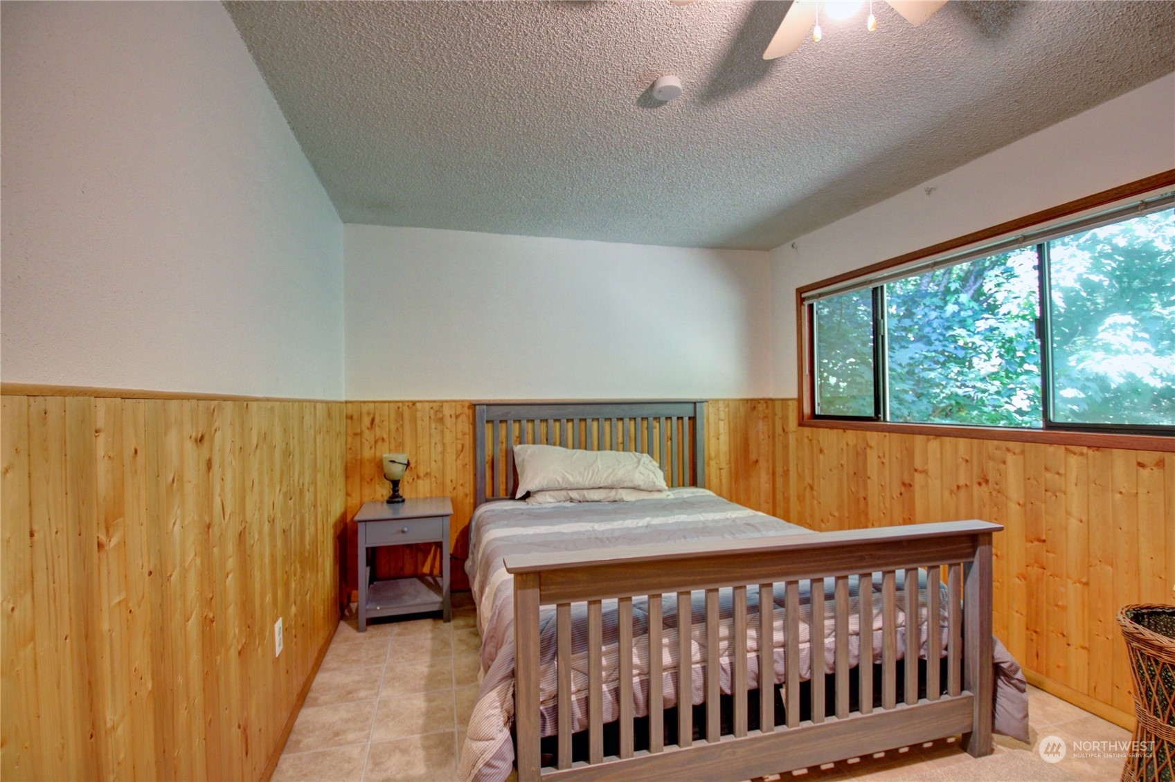 16105 OK Mill Road Snohomish, WA 98290 - Photo 17 of 34 a bedroom with a bed and a window