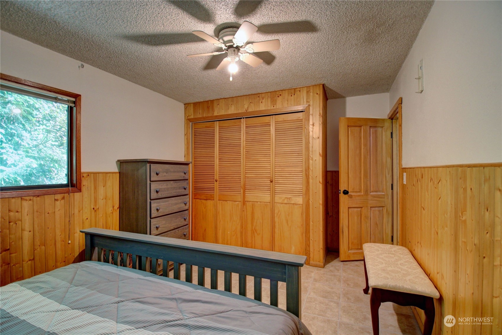 16105 OK Mill Road Snohomish, WA 98290 - Photo 18 of 34 a bedroom with a bed and a table