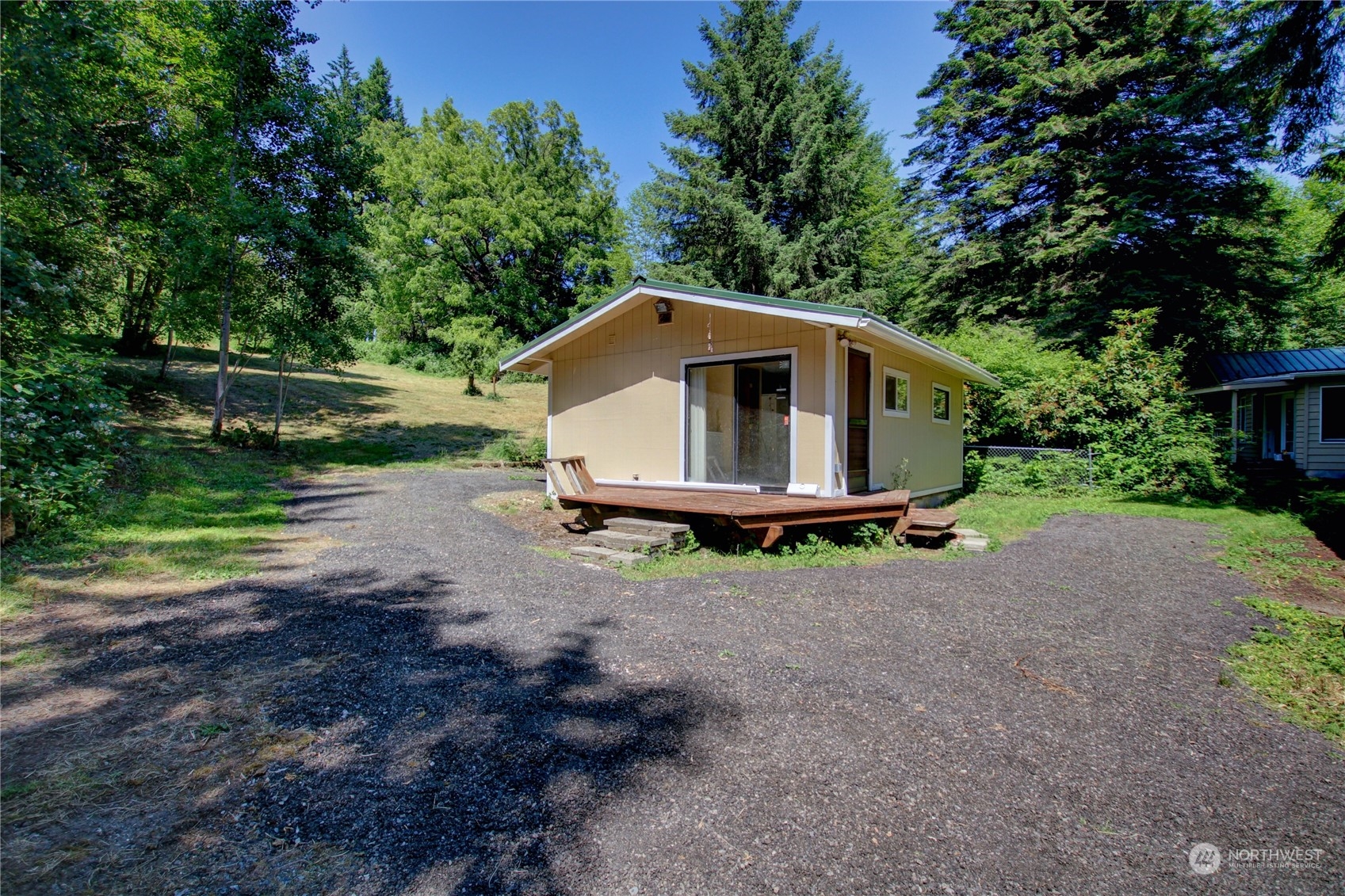 16105 OK Mill Road Snohomish, WA 98290 - Photo 26 of 34 a backyard of a house with barbeque oven fire pit table and chairs
