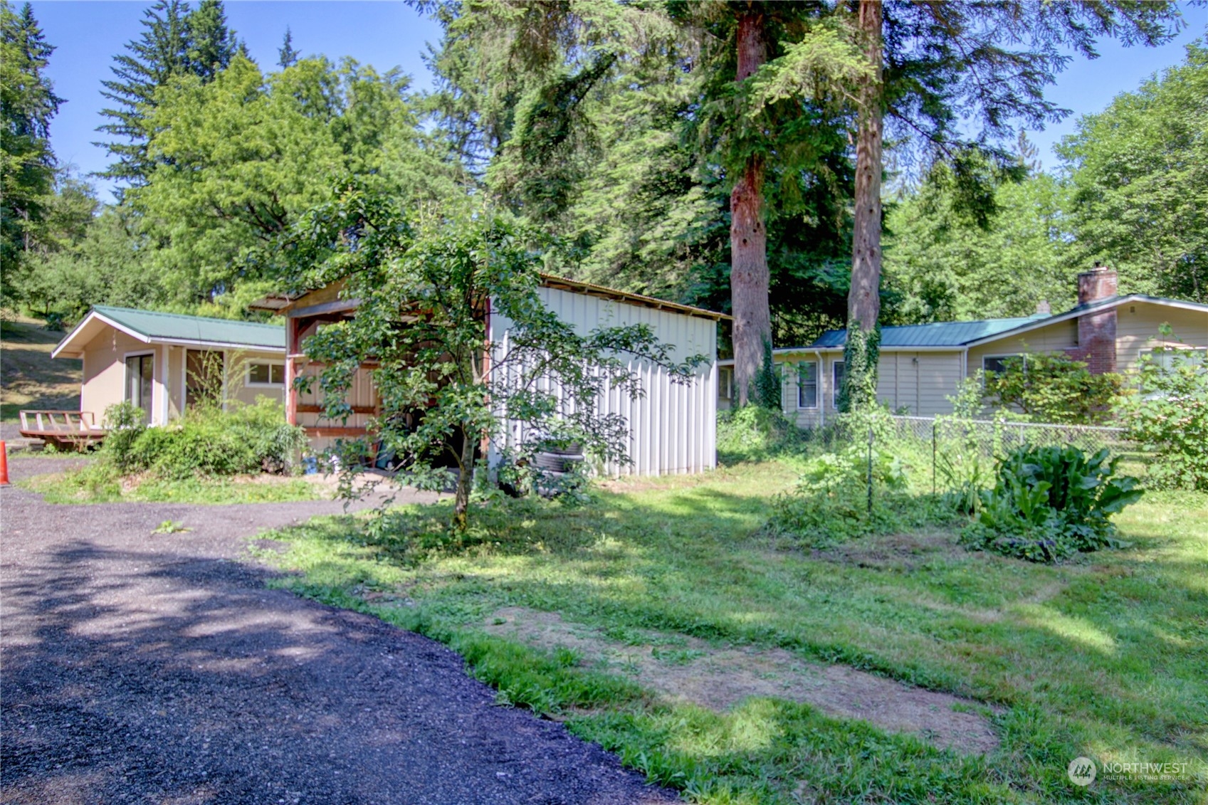 16105 OK Mill Road Snohomish, WA 98290 - Photo 33 of 34 a view of a garden with potted plants and large trees