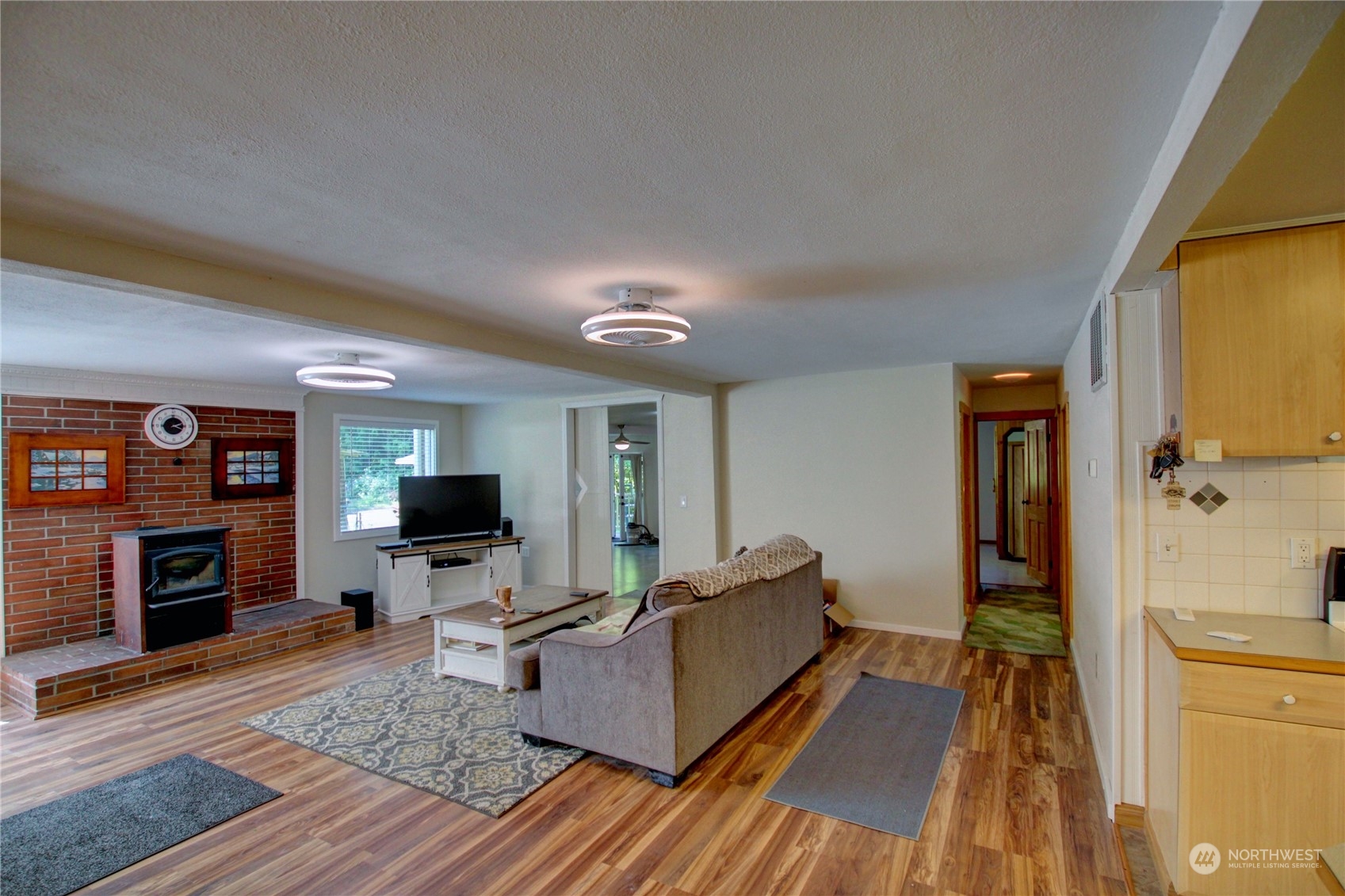 16105 OK Mill Road Snohomish, WA 98290 - Photo 6 of 34 a living room with furniture and a flat screen tv
