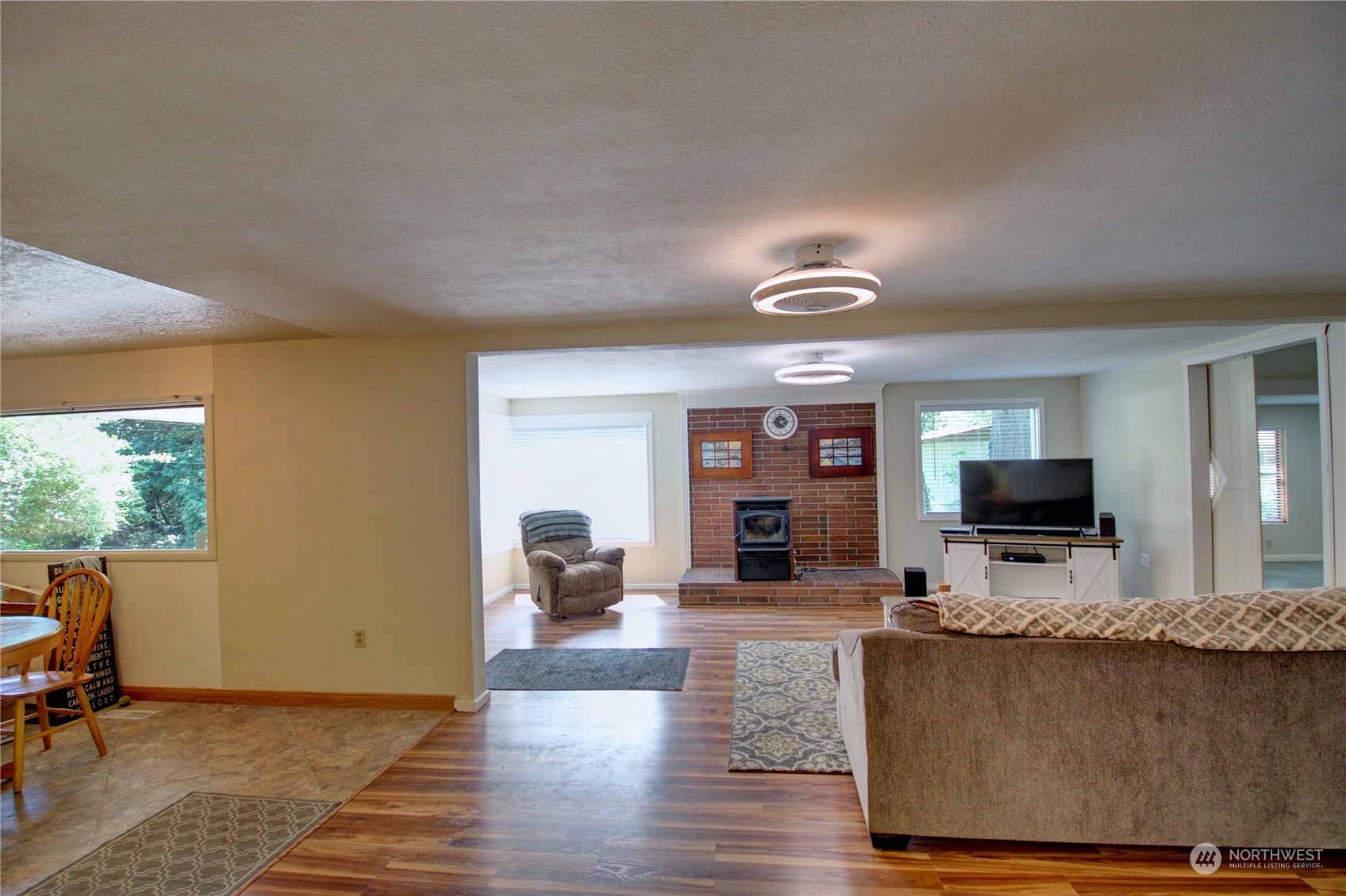 16105 OK Mill Road Snohomish, WA 98290 - Photo 7 of 34 a living room with furniture and a flat screen tv