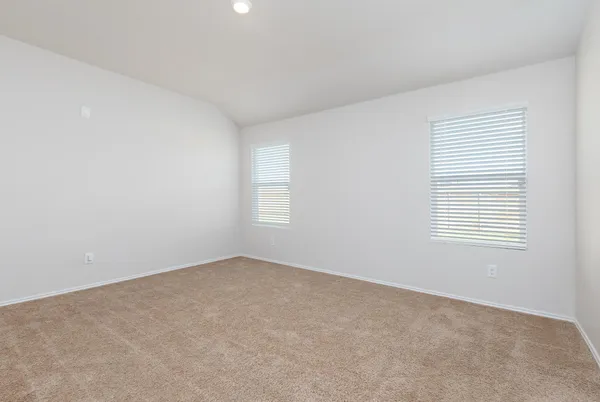 a view of an empty room with a closet