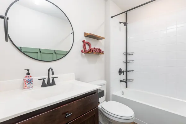a bathroom with a shower and a tub