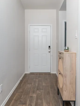 a kitchen with a sink appliances and cabinets