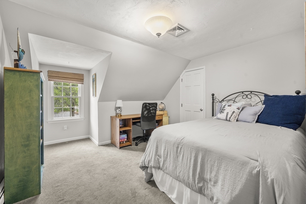 30 Franklin Rodgers Road Hingham, MA 02043 - Photo 21 of 37 a bedroom with a bed next to a window
