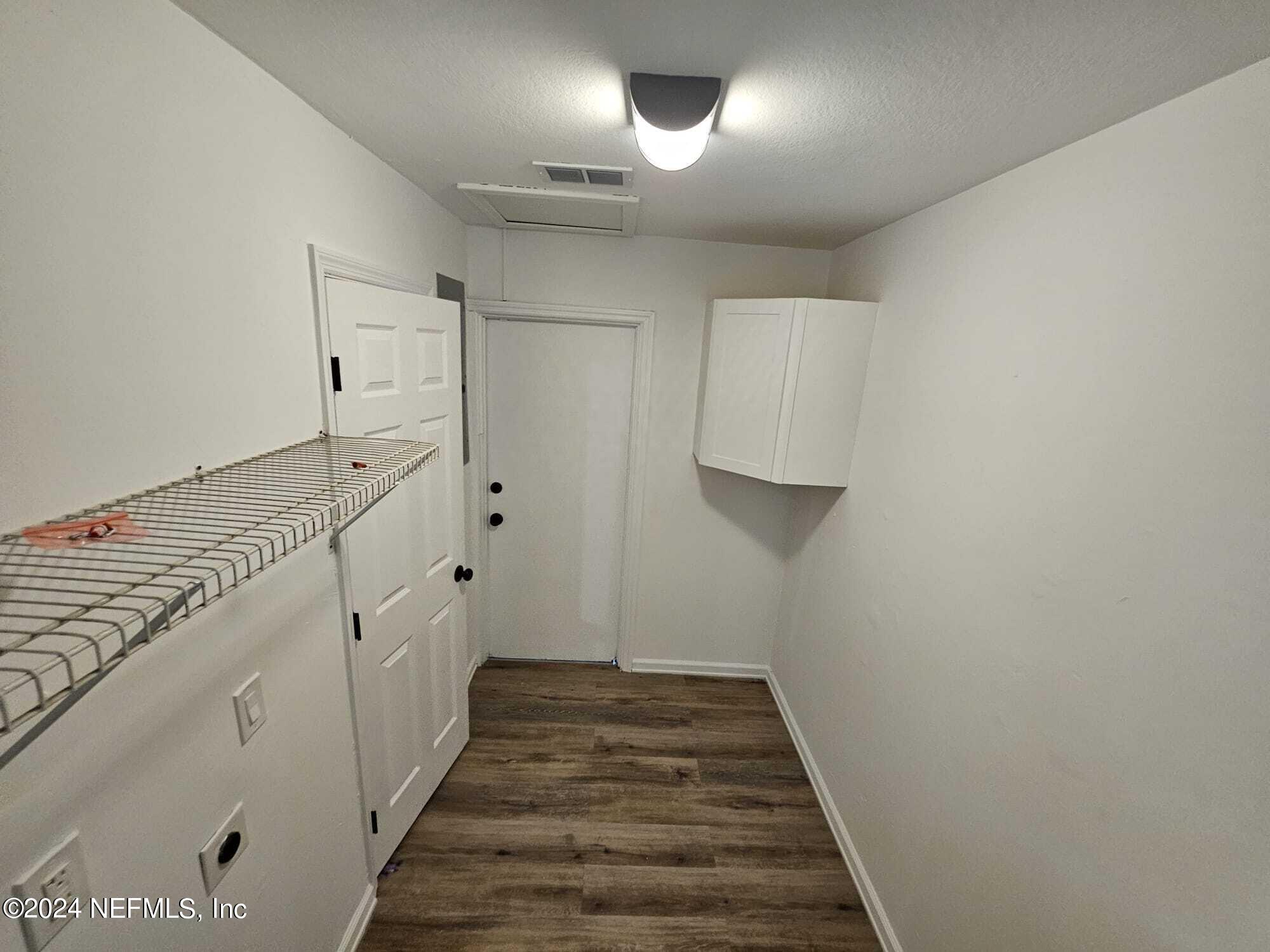 7504 Wheat Road Jacksonville, FL 32244 - Photo 21 of 31 a view of a hallway with staircase