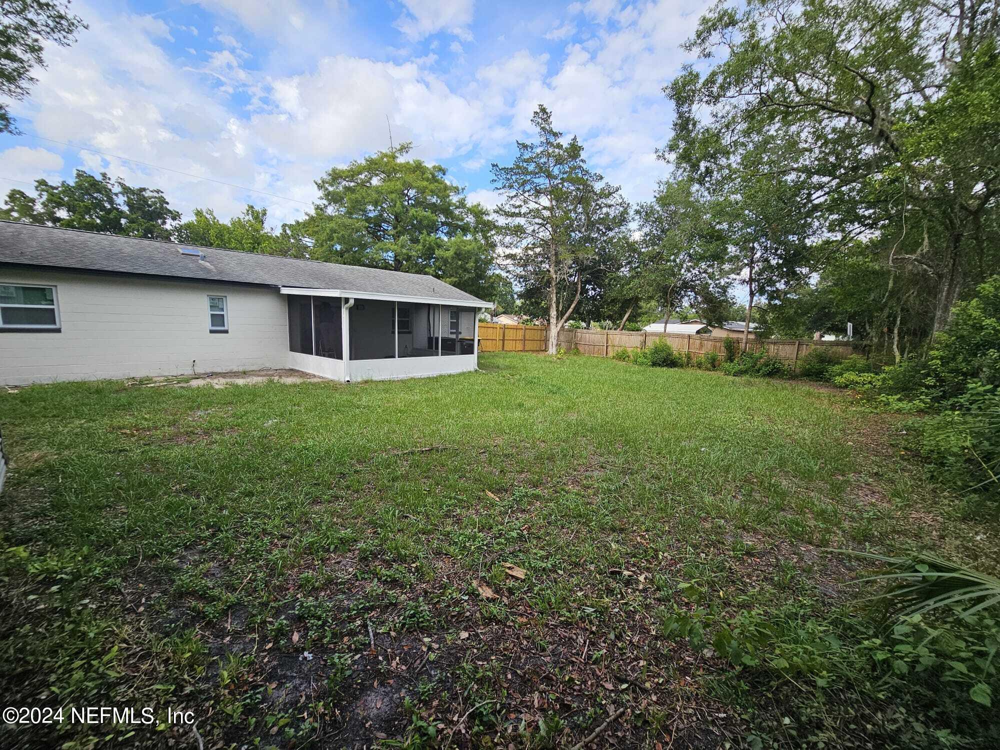 7504 Wheat Road Jacksonville, FL 32244 - Photo 23 of 31 a house view with a garden space