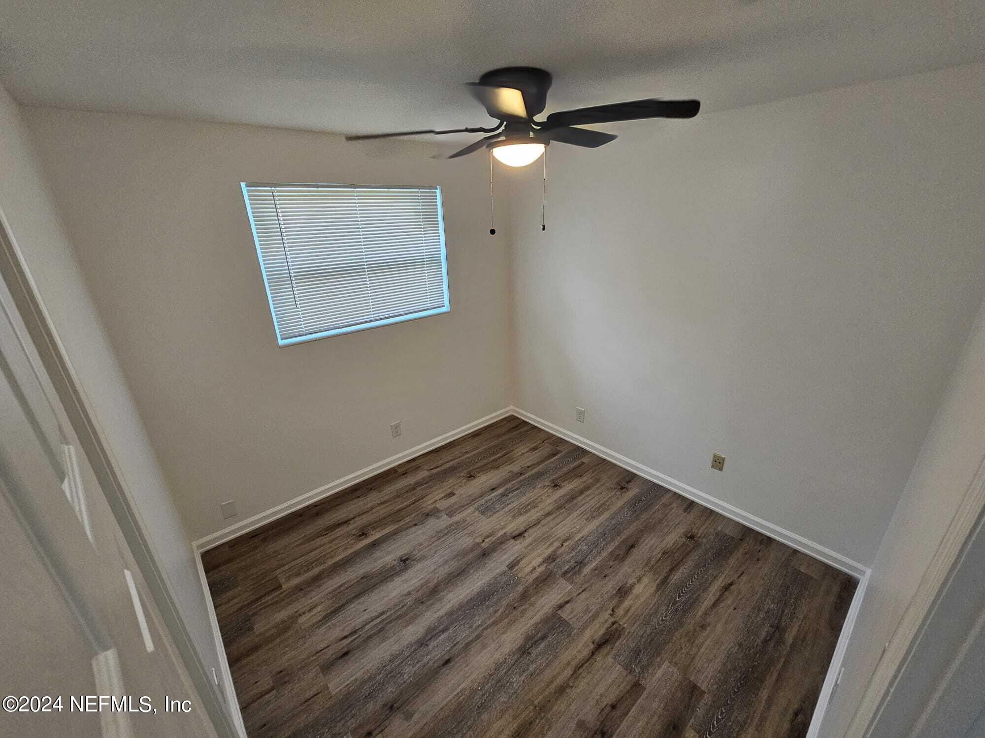 7504 Wheat Road Jacksonville, FL 32244 - Photo 29 of 31 a view of an empty room with a window