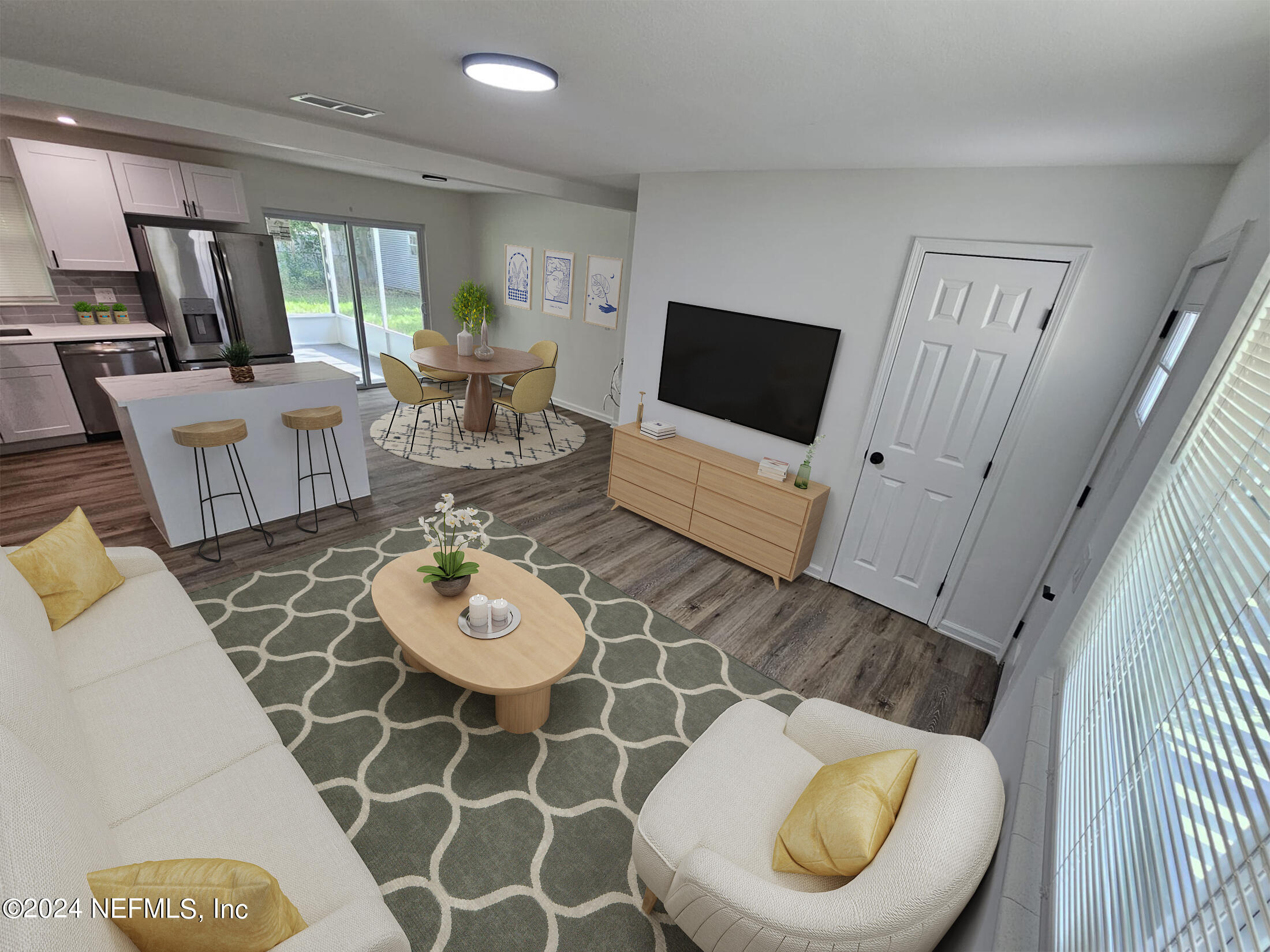7504 Wheat Road Jacksonville, FL 32244 - Photo 3 of 31 a living room with furniture and a flat screen tv