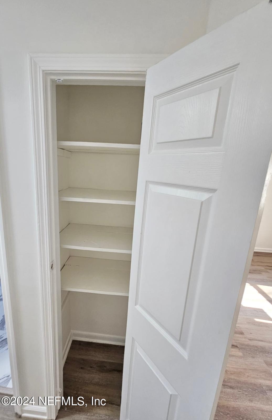 7504 Wheat Road Jacksonville, FL 32244 - Photo 31 of 31 a view of walk in closet with empty racks
