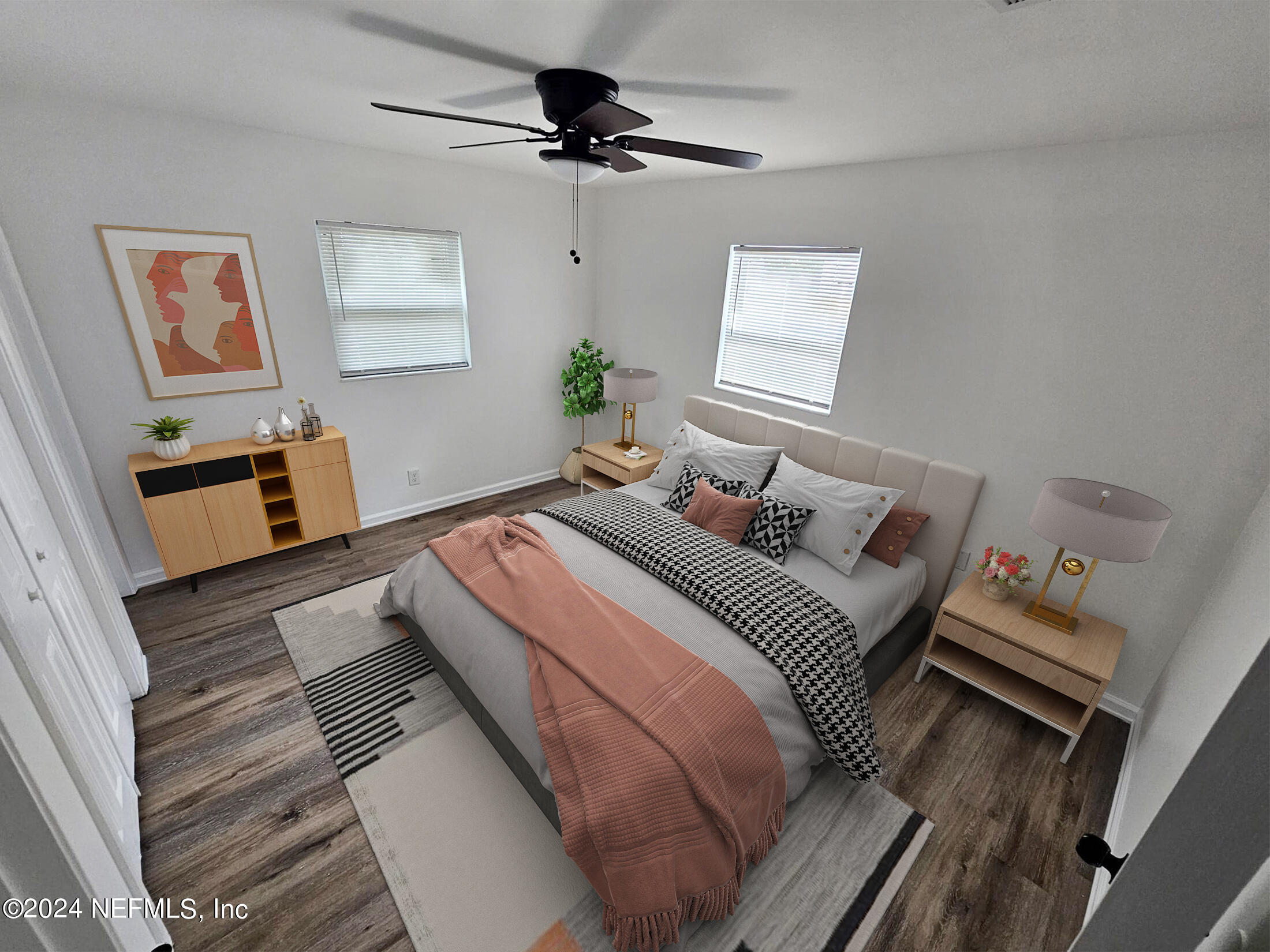 7504 Wheat Road Jacksonville, FL 32244 - Photo 10 of 31 a bedroom with a bed and wooden floor