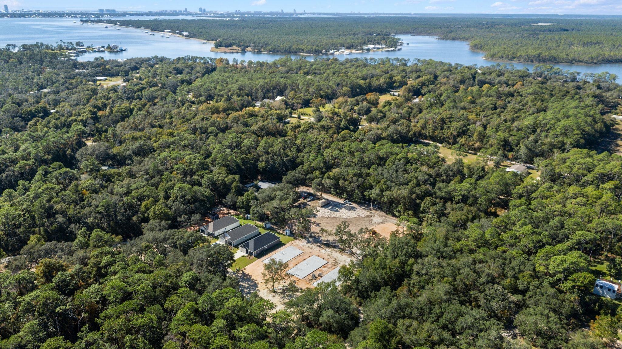 8657 Anniston Drive Elberta, AL 36530 - Photo 14 of 21 Aerial view of a heavily wooded area and a nearby body of water