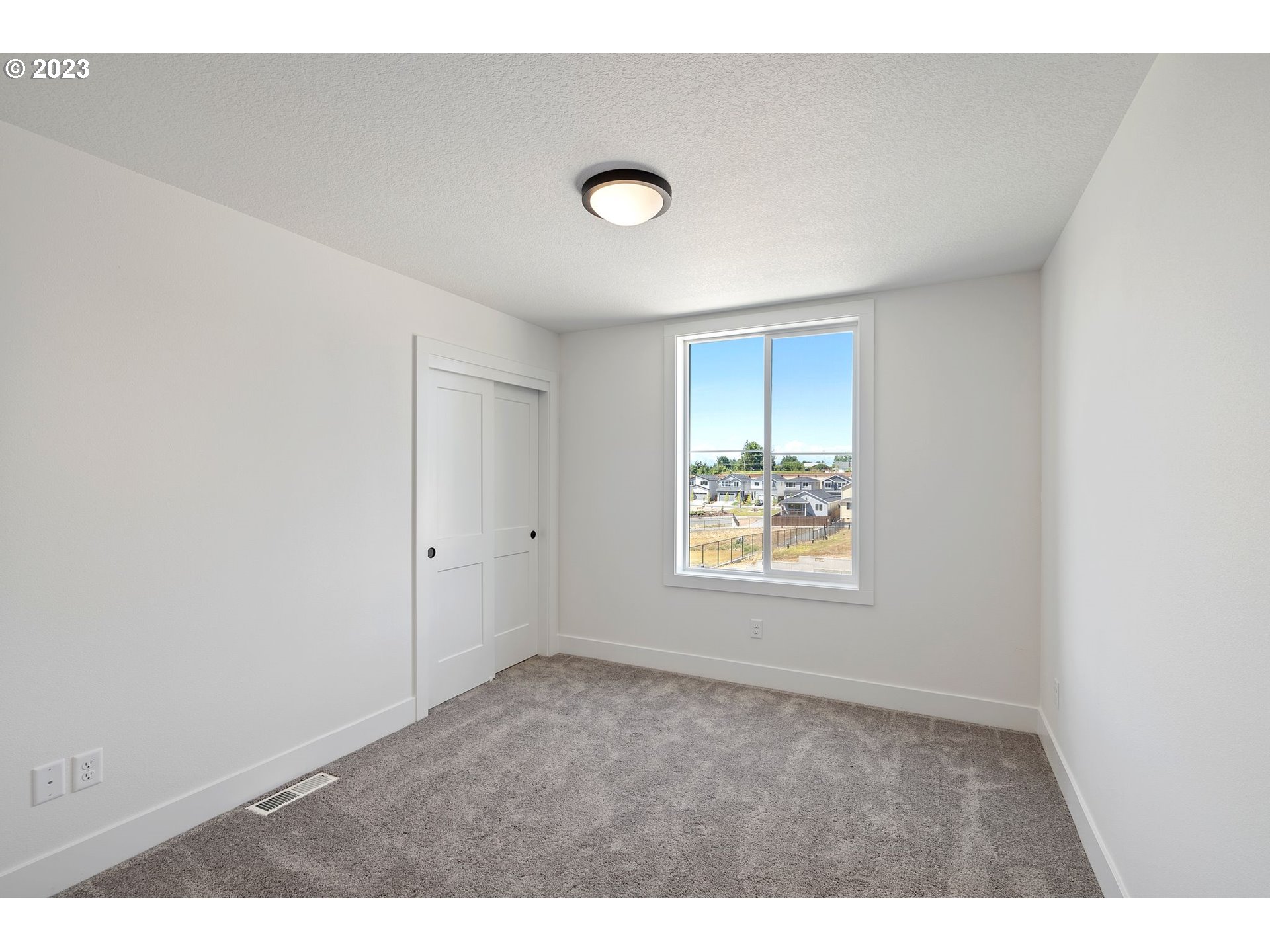 711 Northwest 175th Way Ridgefield, WA 98642 - Photo 17 of 21 a view of an empty room with a window
