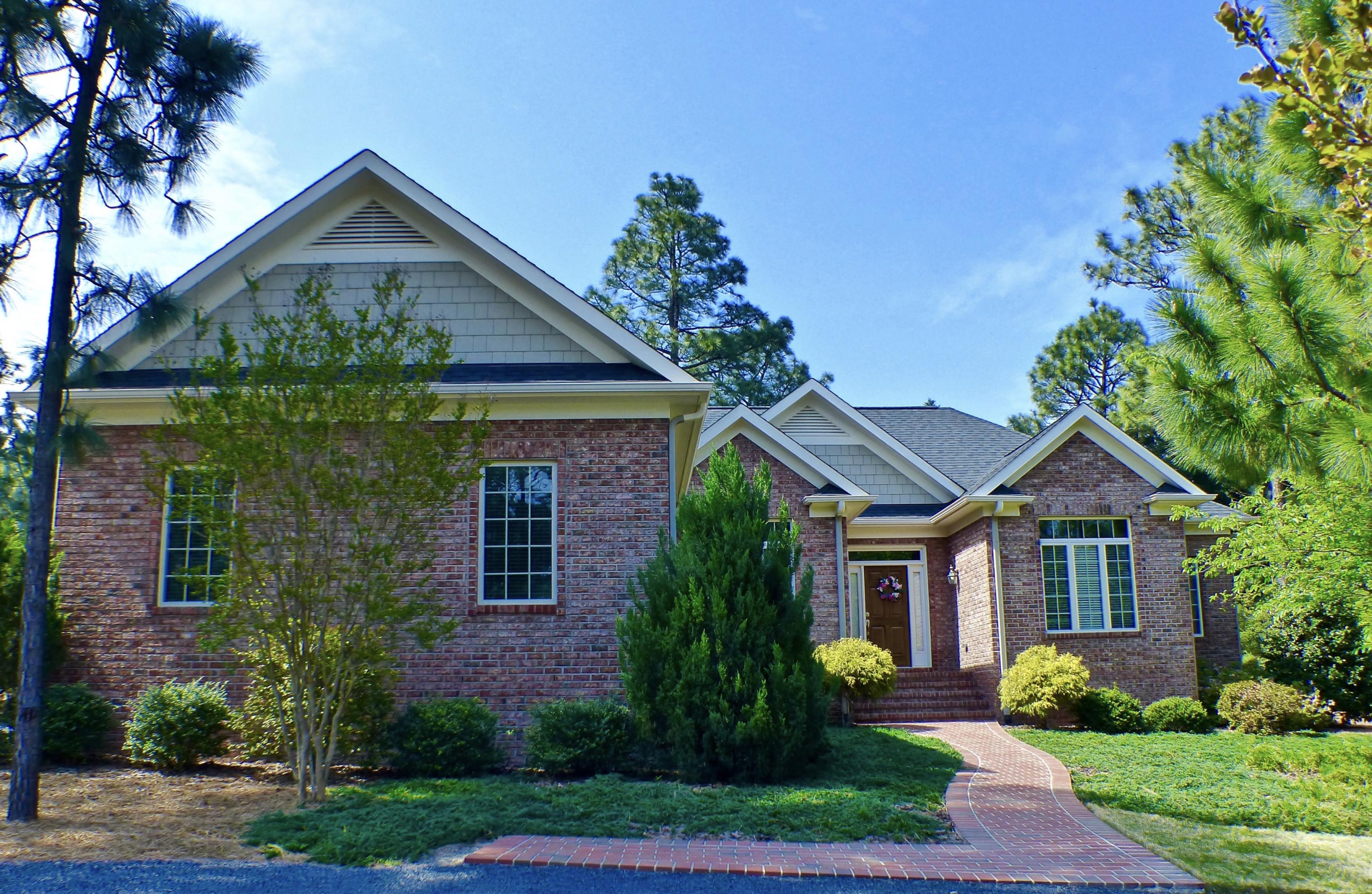 3 Oak Meadow Road Pinehurst, NC 28374 - Photo 1 of 27 Beautiful custom brick home at Fairwoods on 7