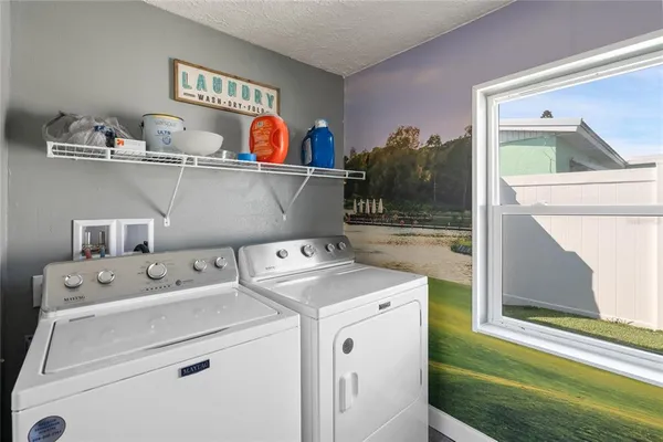 a utility room with dryer and washer