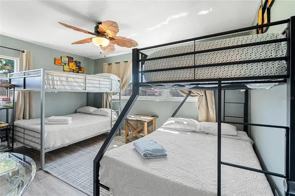 a bedroom with furniture and a chandelier