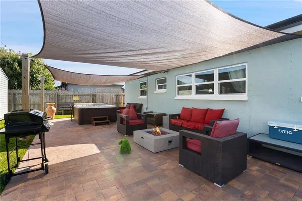 a living room with furniture and a window