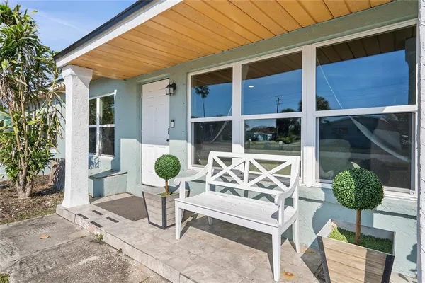 a view of a chairs and table in patio