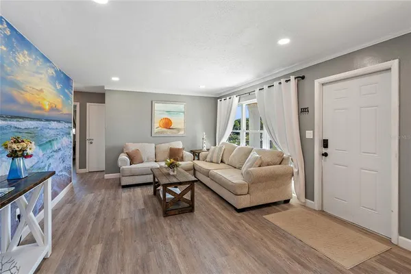 a living room with furniture and a window