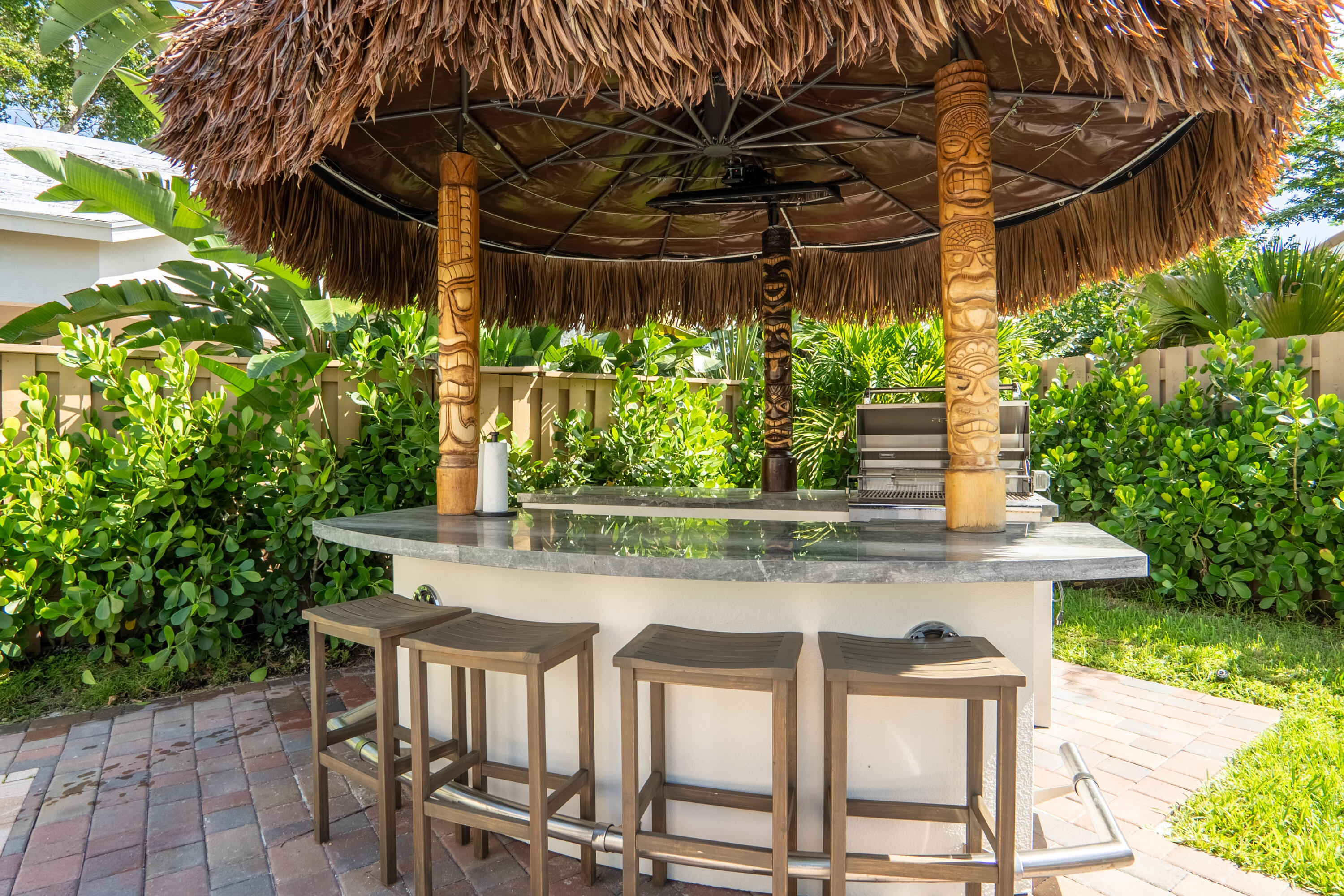6670 Northwest 27th Avenue Boca Raton, FL 33496 - Photo 11 of 43 a view of a chairs and table in a backyard