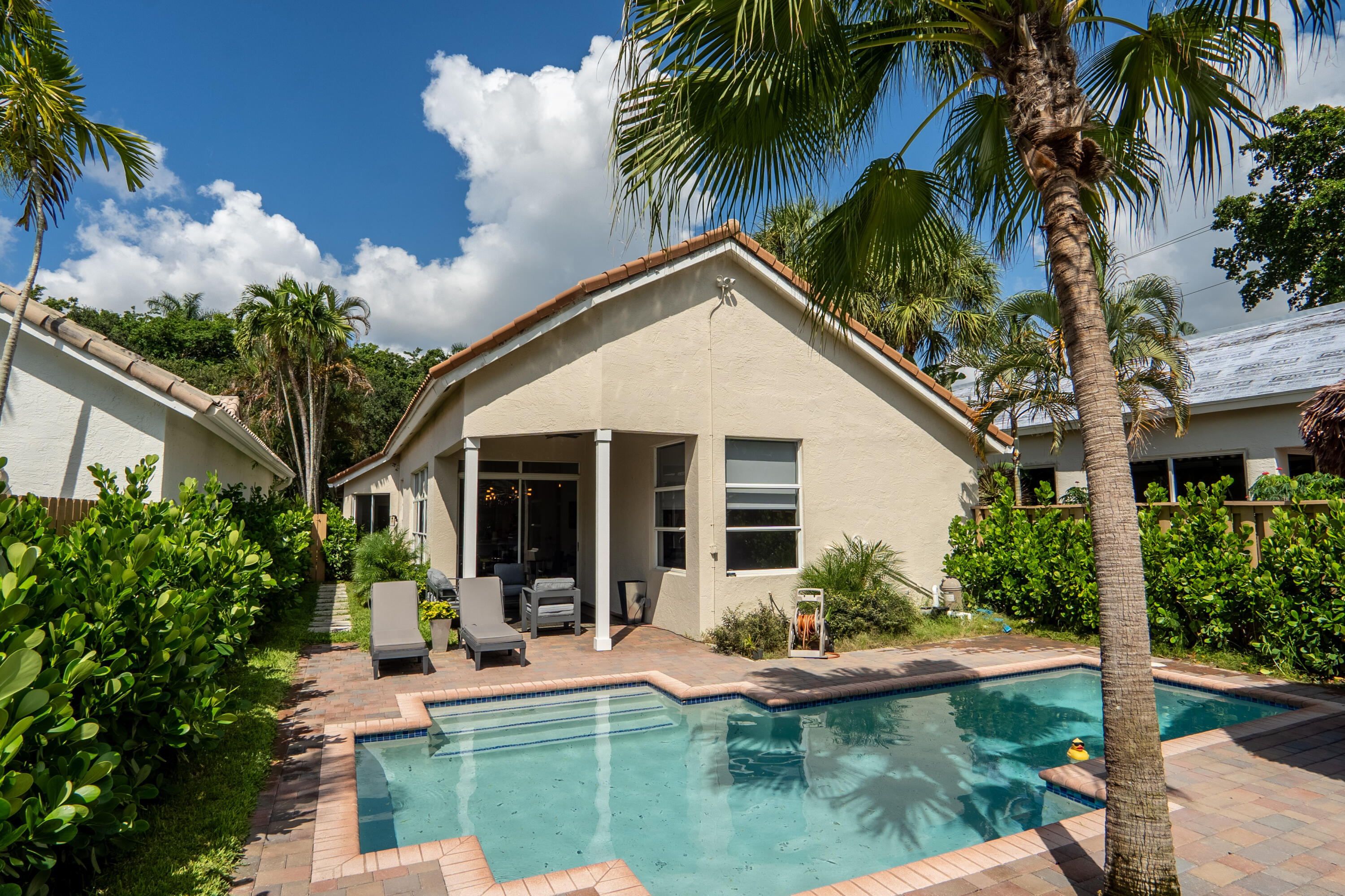 6670 Northwest 27th Avenue Boca Raton, FL 33496 - Photo 12 of 43 a view of a house with pool and sitting area