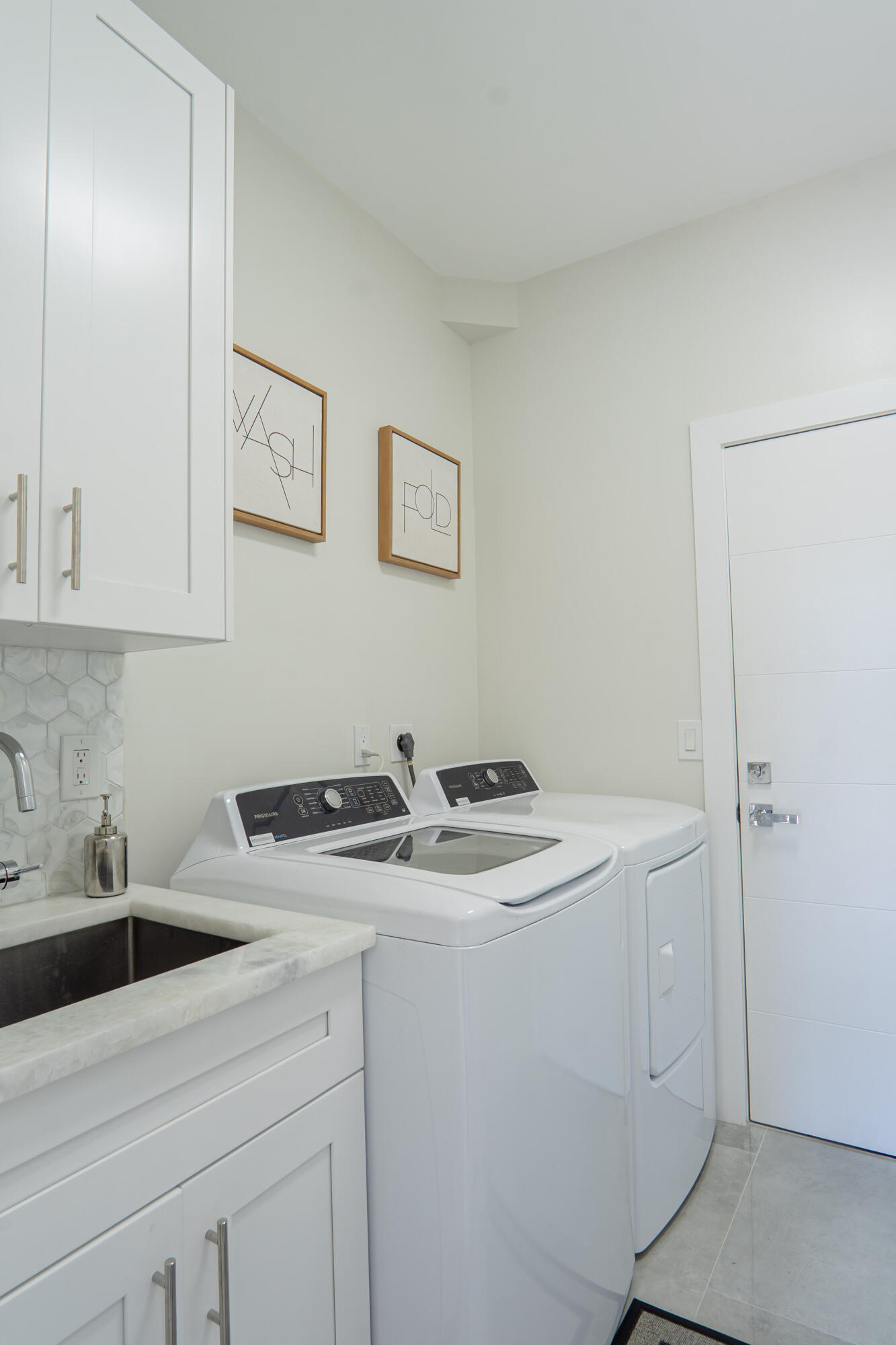 6670 Northwest 27th Avenue Boca Raton, FL 33496 - Photo 27 of 43 a utility room with dryer and washer